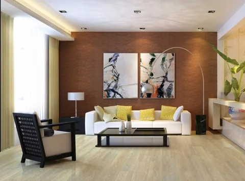 Living room with timber flooring, a timber feature wall and green chairs.