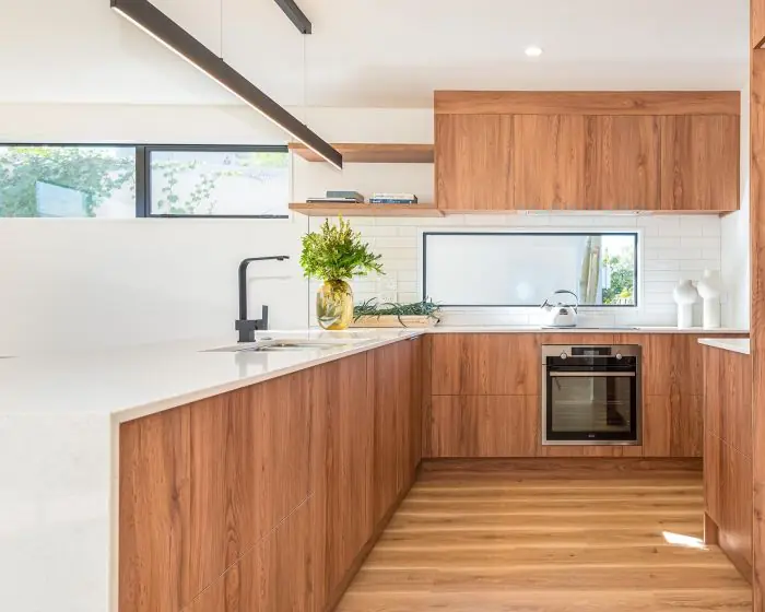 Alba zero silica quartz — light kitchen with timber cabinetry